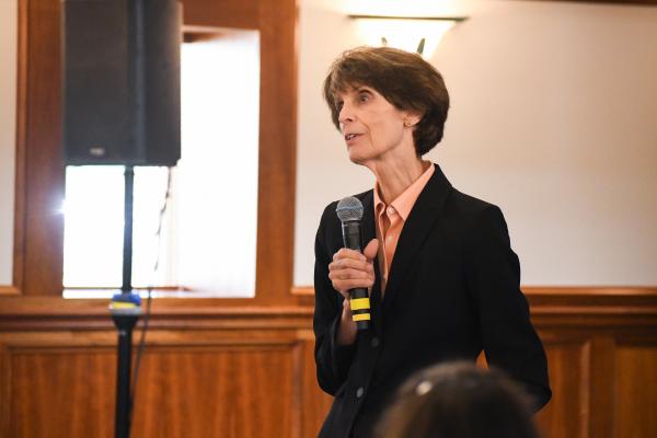 a photograph of Martha Riddell speaking at an event